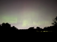 There was a big solar storm in August, lots of northern lights. This picture was taken near our house by Lake Nokomis. The sensor on the camera picked up more color than I could see with my eyes.