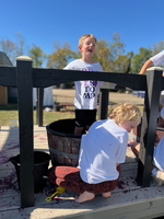 Brennan and Imogene competing in the Grape Stomp competition