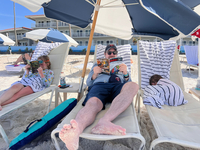 Relaxing on beach, getting some reading in.