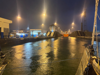 Going through the locks of the Panama Canal at night in the rain