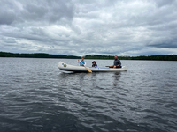 Brennan, Imogene, and Jachin canoeing on Burnside on our blueberry picking adventure